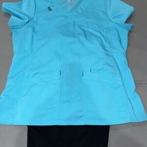 Light Blue Scrubstar Top with black bottoms